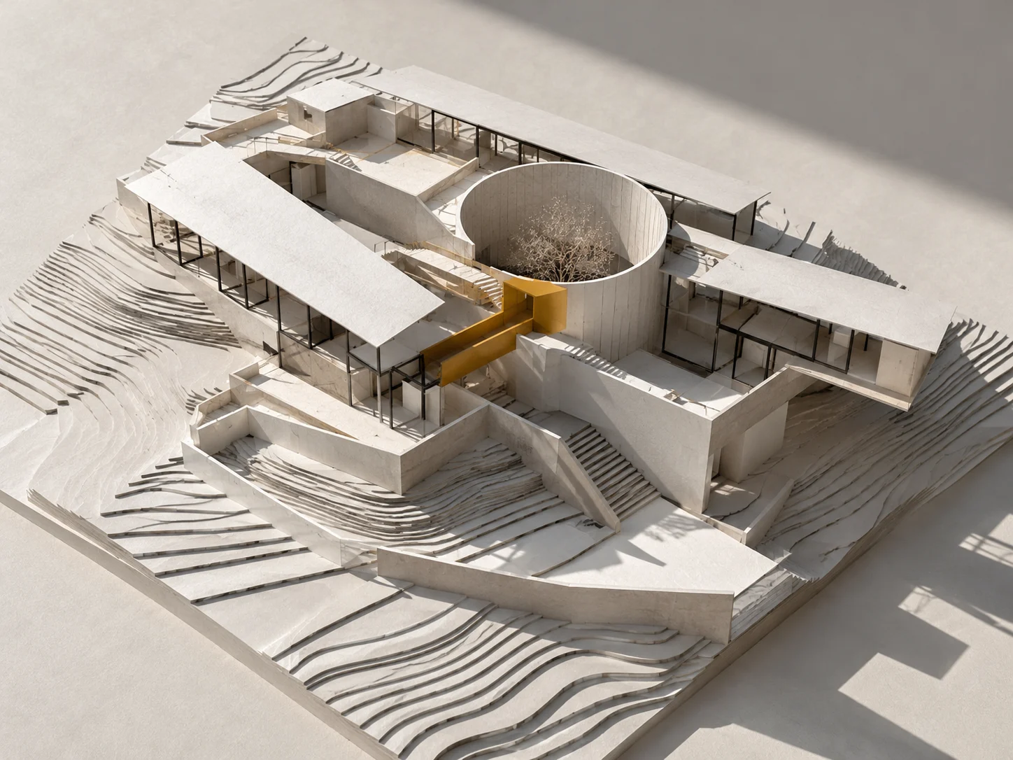Conceptual architectural model with a circular courtyard and a yellow circulation element.